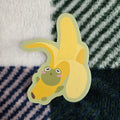 frog stuck in a banana costume, matte vinyl sticker